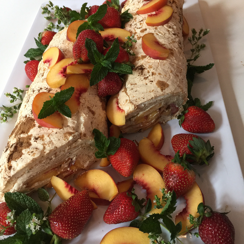 Wattleseed Pavlova Roulade filled with Wattleseed and Honey Cream, Stawberries and Peaches